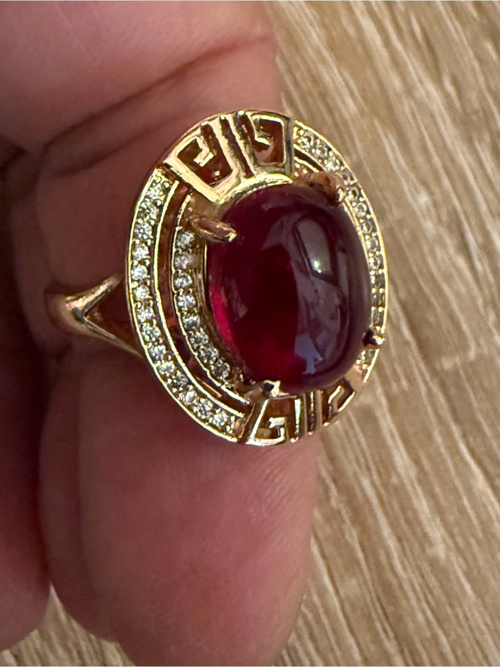 Gold Ring with Deep Red Cabochon and Pavé Accents